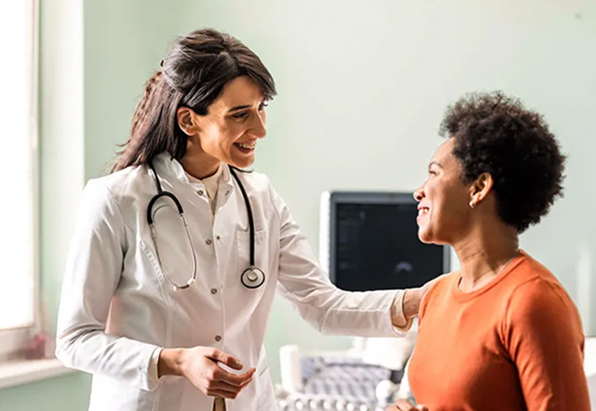 Female doctor speaking with her patient
