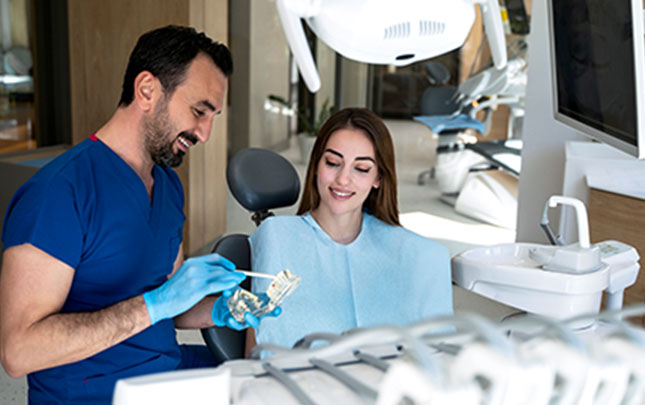 Dentist talking to a patient about procedure