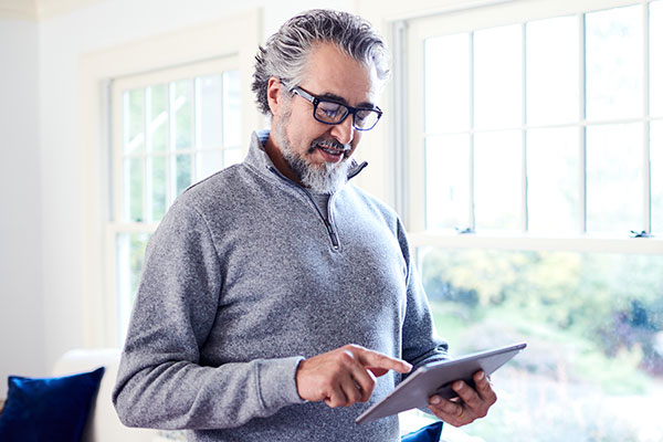 Man looking at tablet